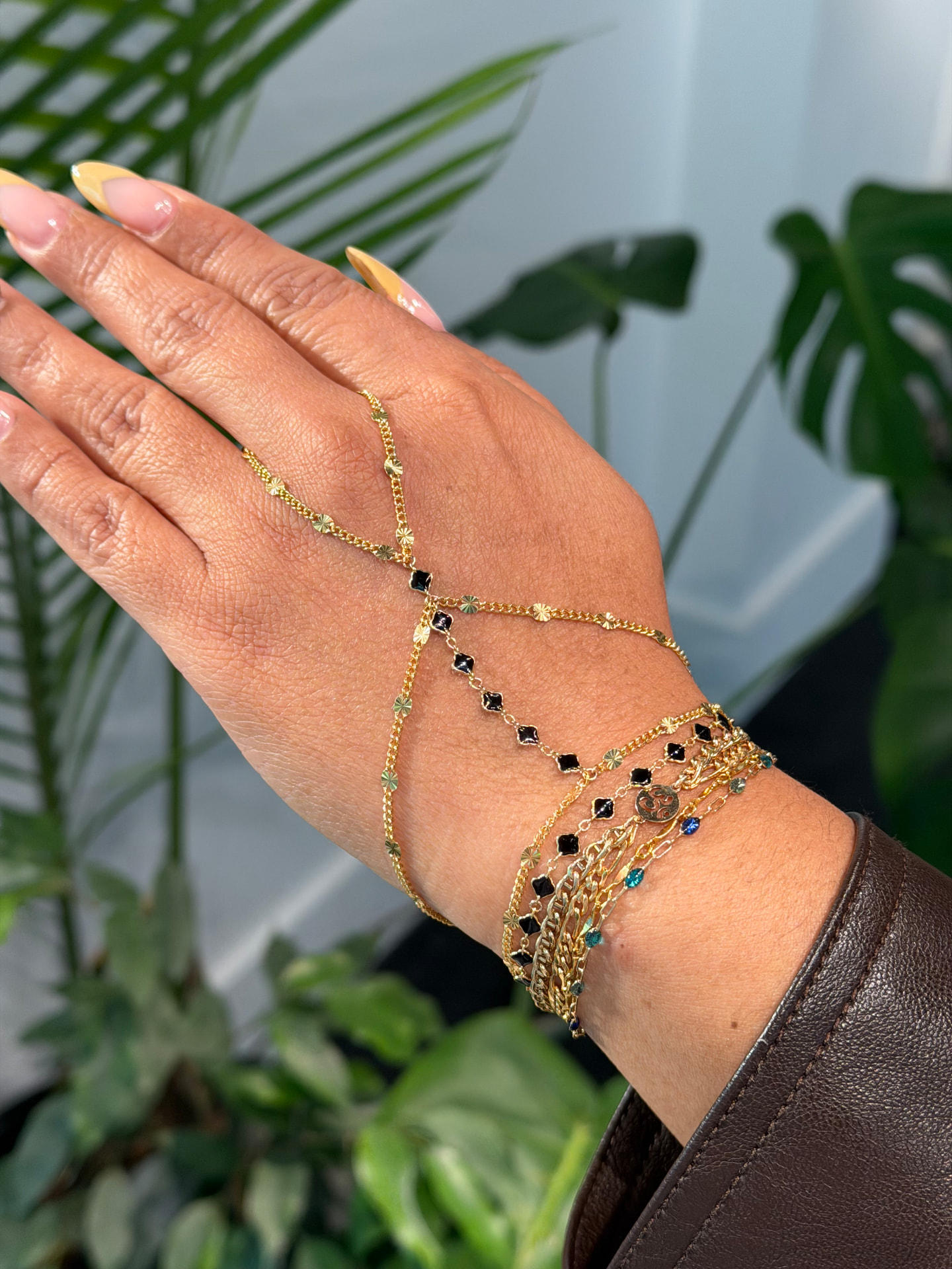 Gold permanent bracelet stack with hand chain